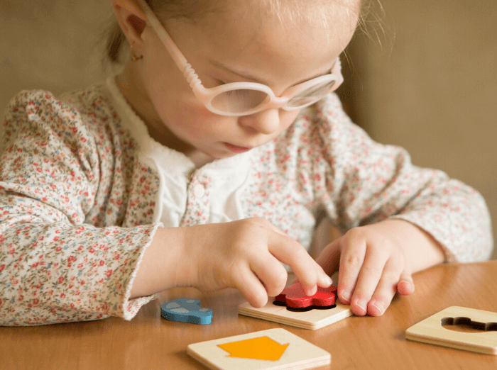 child playing with therapy toys