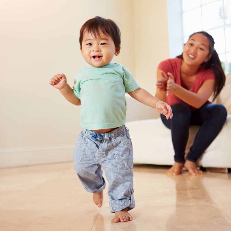Child walking and demonstrating 12 to 18 month old milestones.