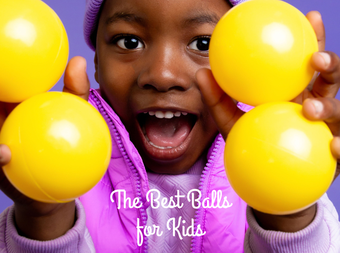 the best balls for kids - child holding yellow balls
